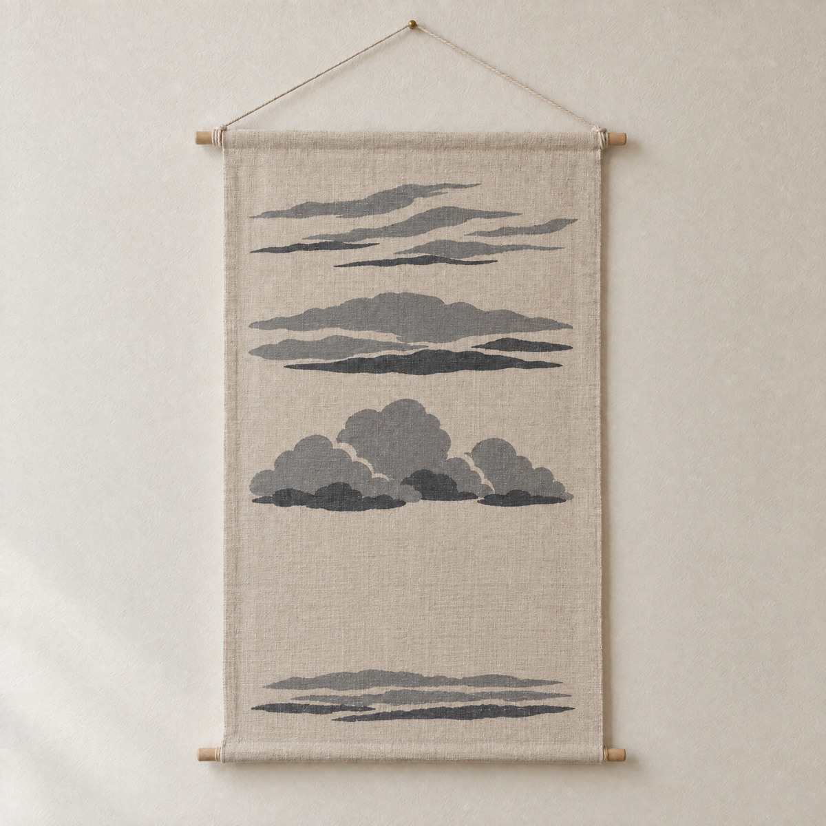 Cloud Types screen-printed canvas wall hanging on beech dowels, hung on a plain wall