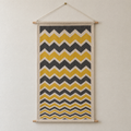 Storm Front screen-printed canvas wall hanging on beech dowels, hung on a plain wall