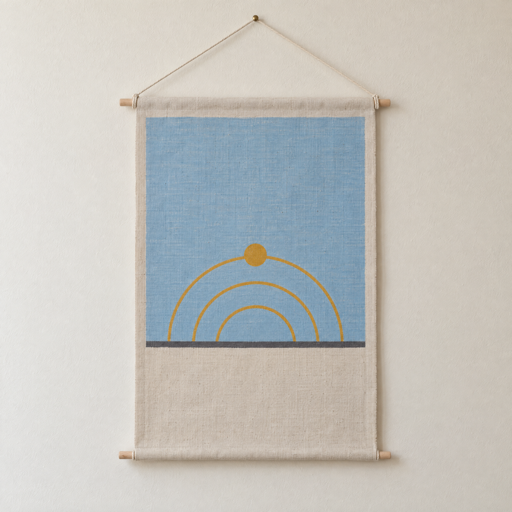 Sun Path screen-printed canvas wall hanging on beech dowels, hung on a plain wall