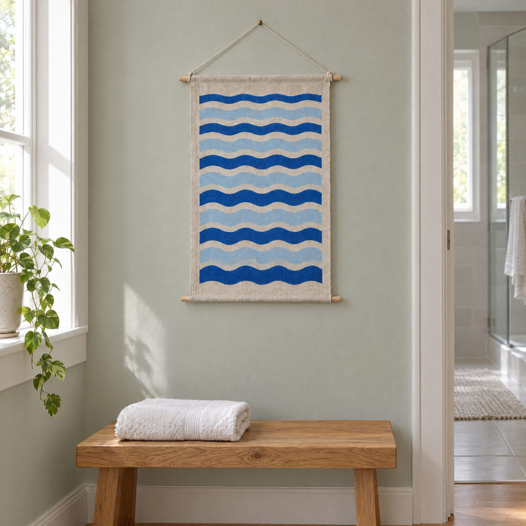 Tide Lines wall hanging above an oak bench in a hallway