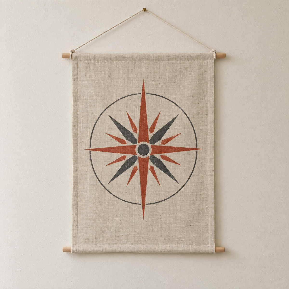 Wind Rose screen-printed canvas wall hanging on beech dowels, hung on a plain wall